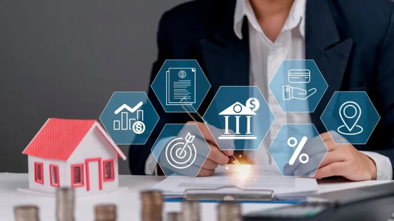 Person in business attire signing documents with a small house model and financial icons overlay.